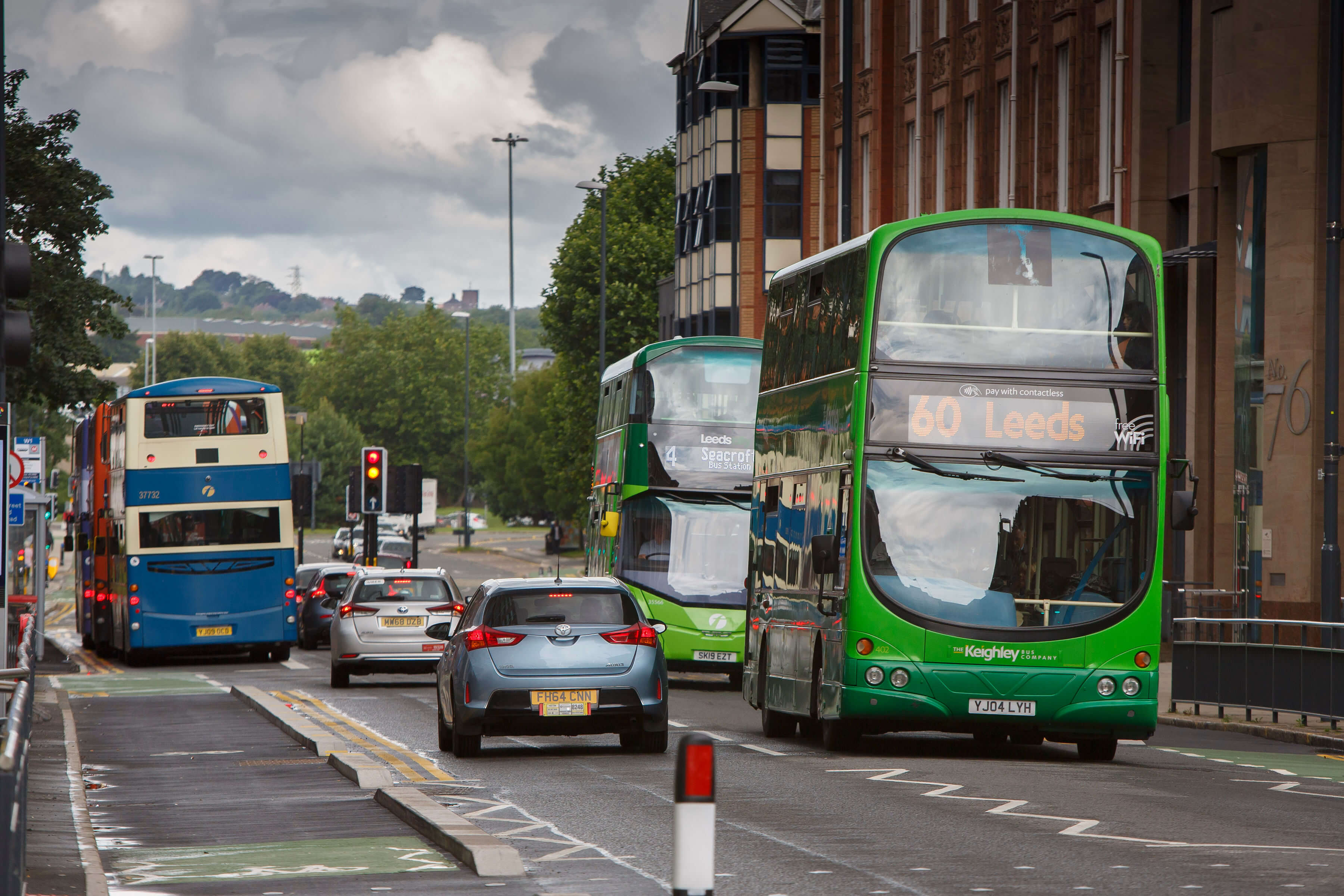 Road in Leeds with buses and cars