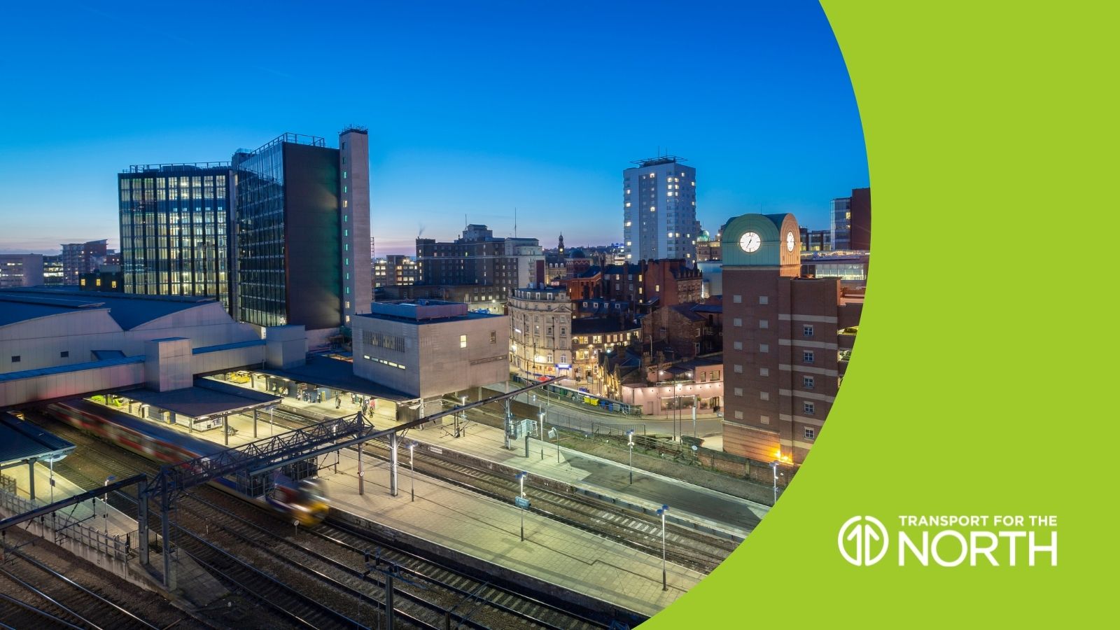 Leeds cityscape and skyline at night showing offices, apartments and railway station