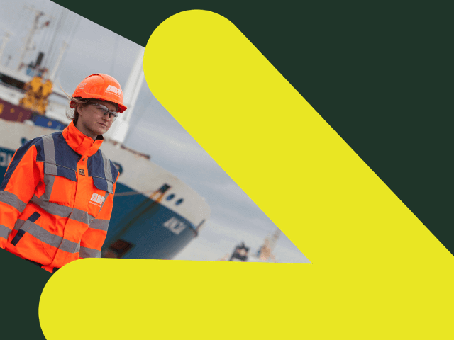 Female ABP worker in front of freight ship