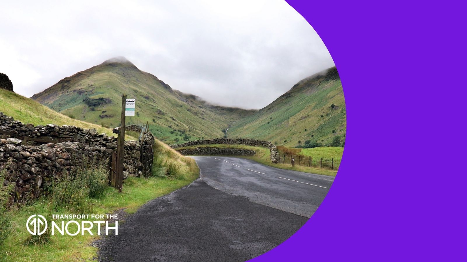 Bus stop on a road leading up to a mountain in the Lake District