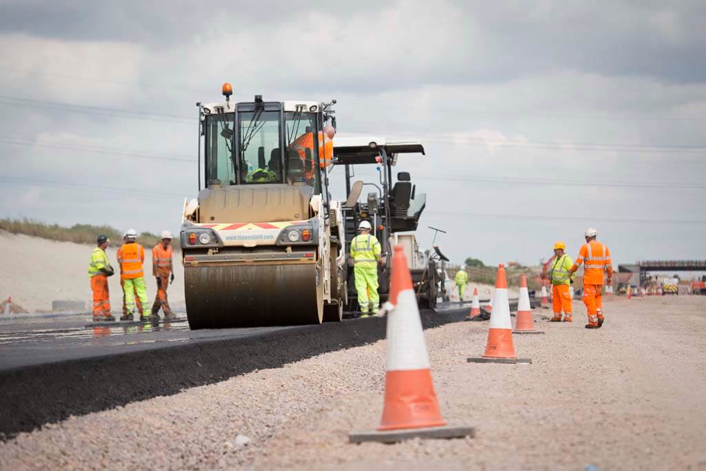 Workmen and rollers on roadworks
